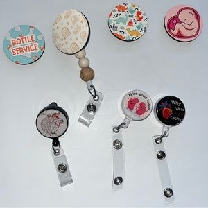 Badge reels! Top ones are interchangeable and are attached by Velcro.